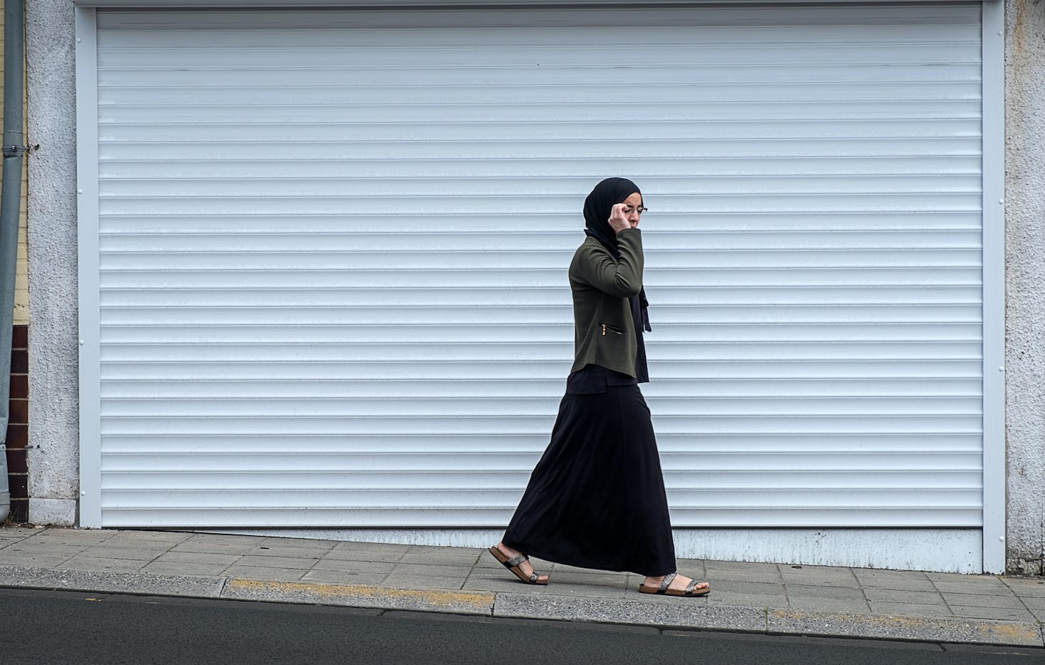 Woman walking on the street in Chatelet, Belgium