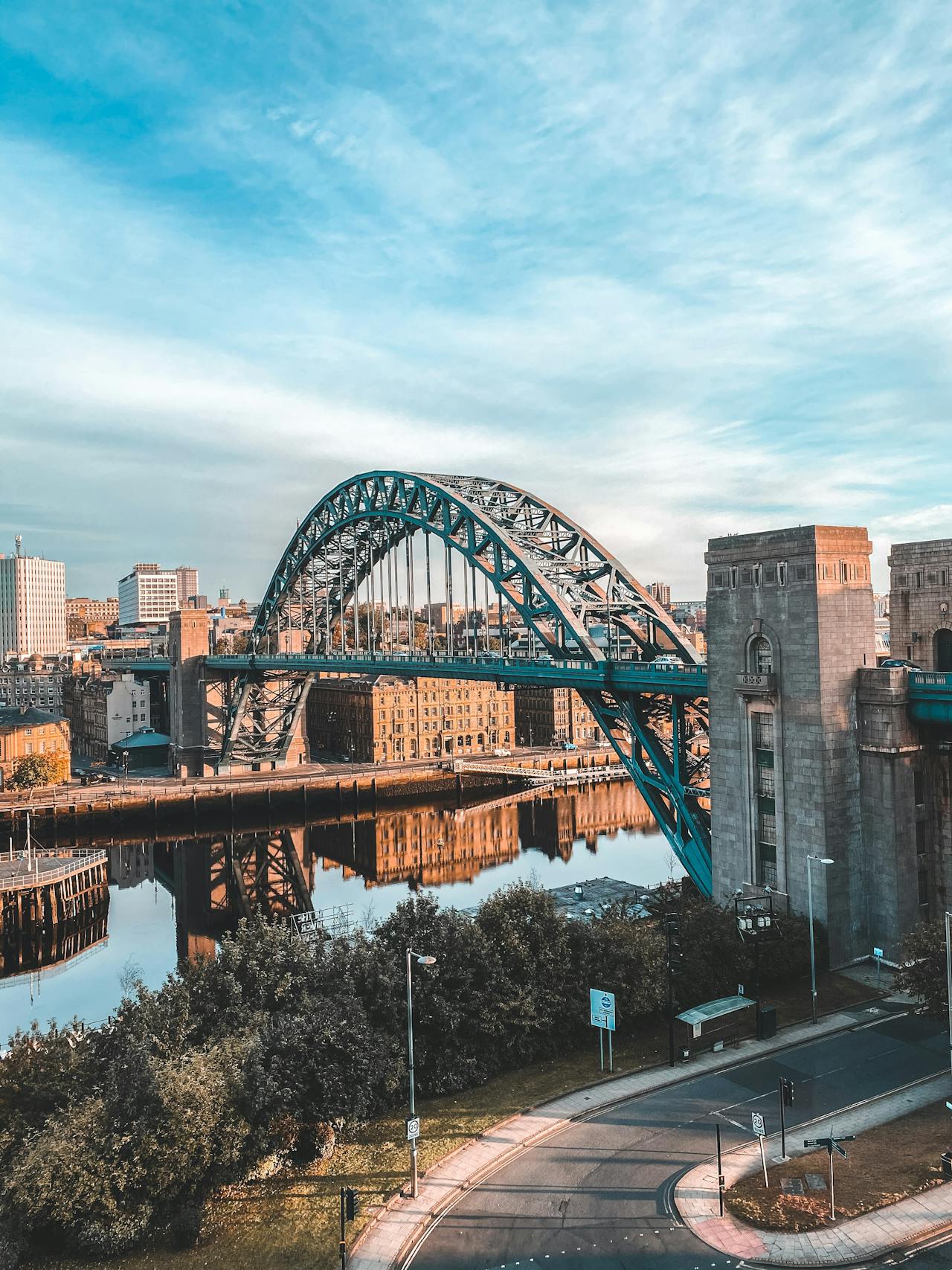 The Tyne Bridge stretches over the River Tyne amidst the city buildings in Newcastle, England The Tyne Bridge stretches over the River Tyne amidst the city buildings in Newcastle, England
