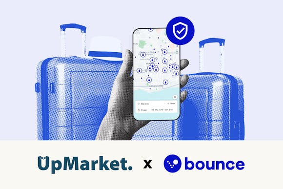 A picture of suitcases and a map on a phone screen to announce a collaboration between Bounce and UpMarket