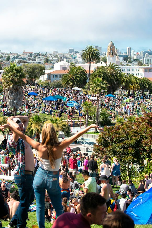 Park filled with visitors celebrating during a vibrant festival