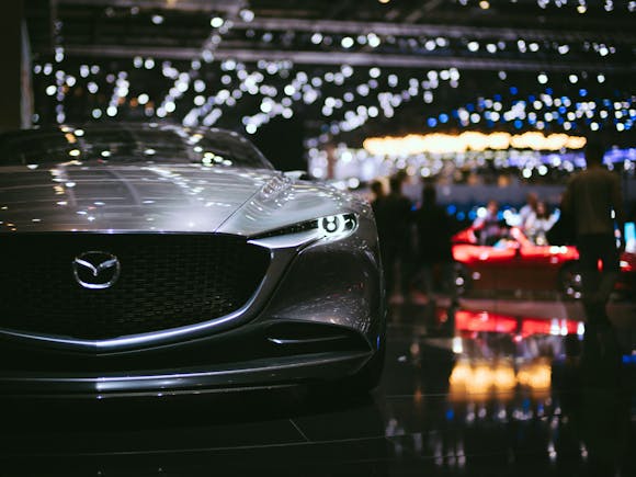 A sleek, modern automobile displayed under bright lighting