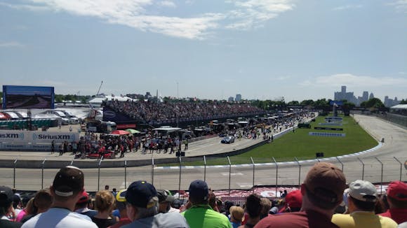 Crowded motor speedway during a sunny day