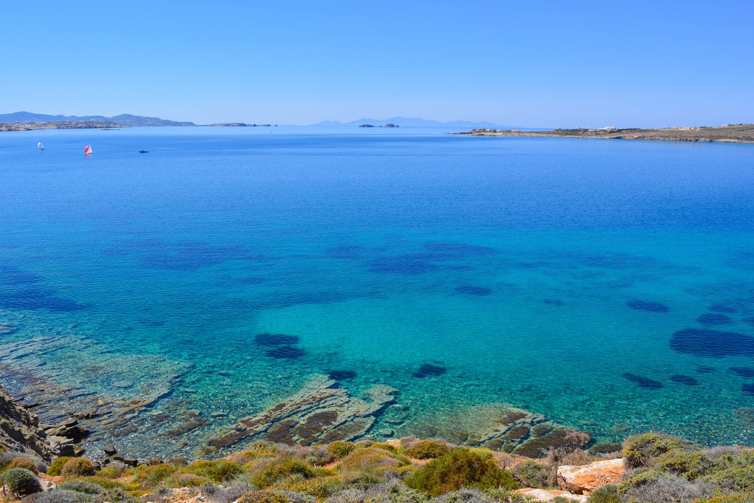 The crystal clear blue waters on the coast of Paros Island in Greece