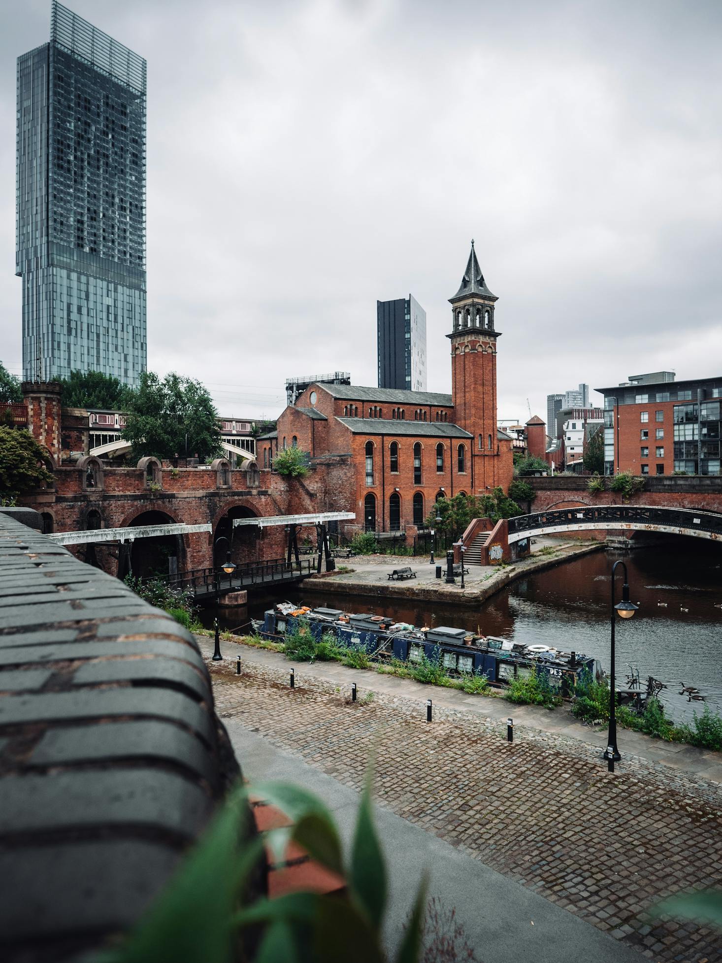 Grey skies overlook tall buildings in Manchester