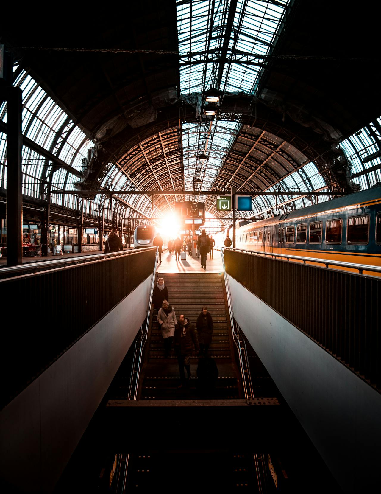 Sun shining on a darkened platform at Amsterdam Centraal Station