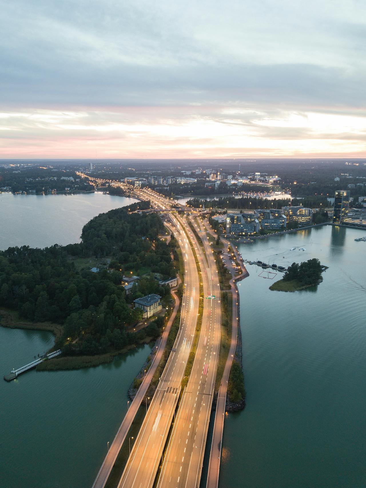 Highway entering Helsinki, Finland at night and surrounded by the Baltic Sea Highway entering Helsinki, Finland at night and surrounded by the Baltic Sea