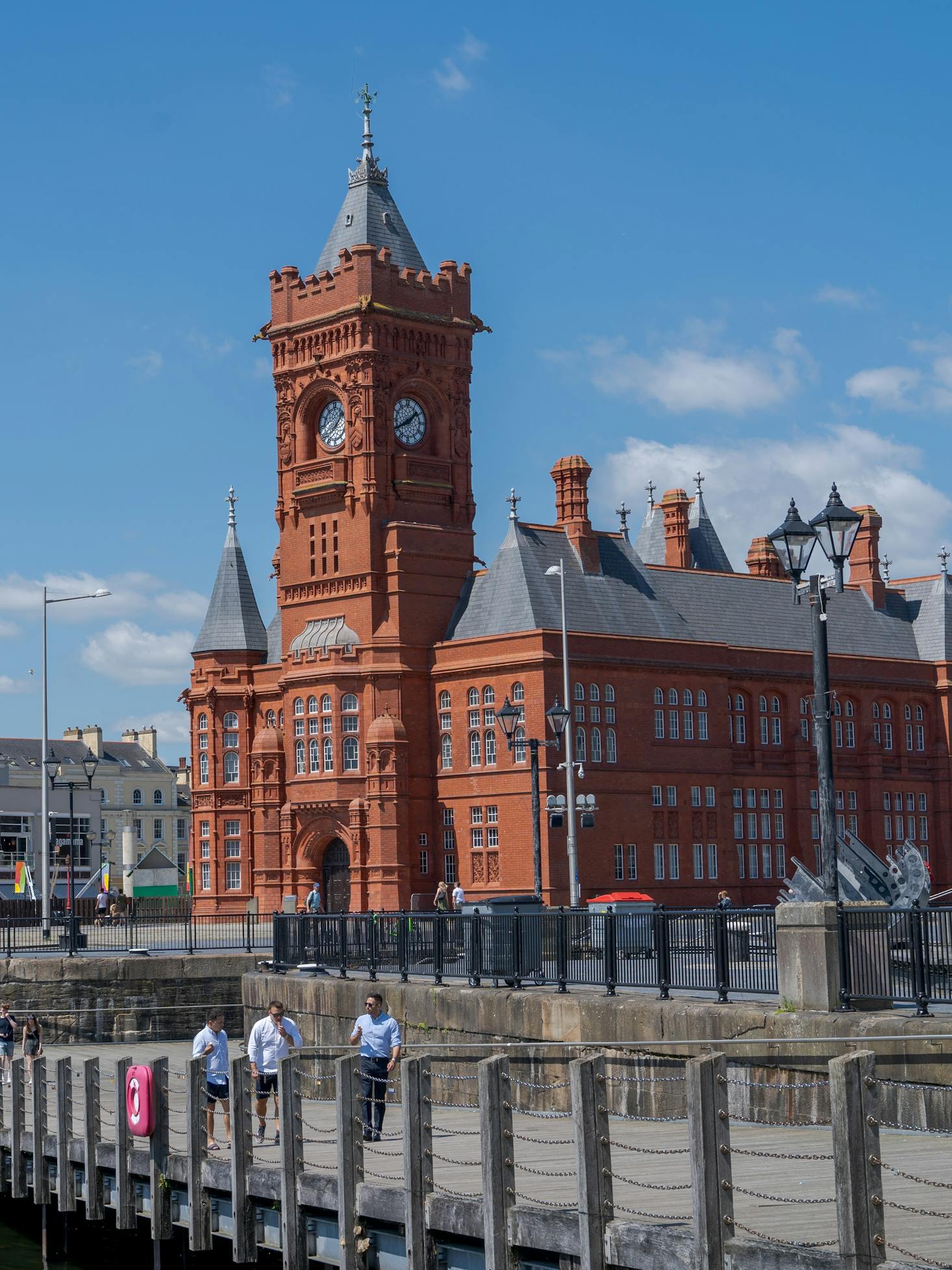 Large red building with a clock tower in Cardiff