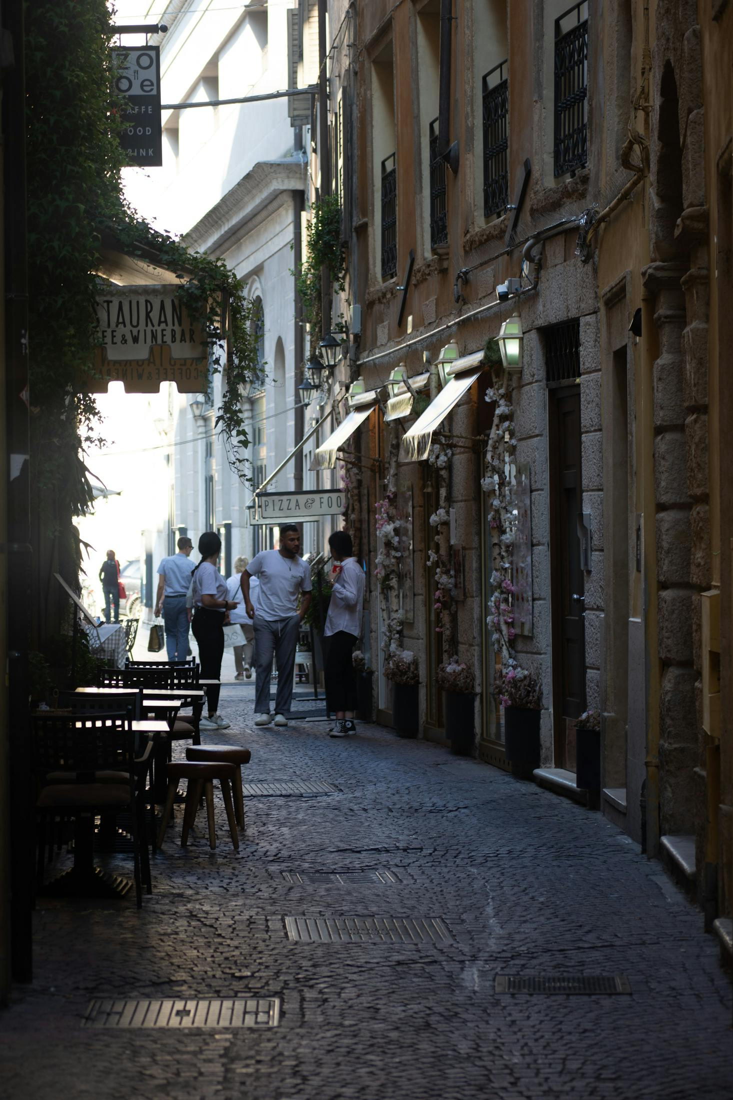 A restaurant with tables out front in Verona, Italy