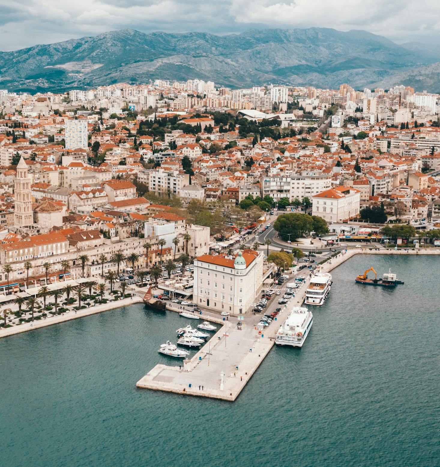 The city of Split found in the port with mountain ranges in the background