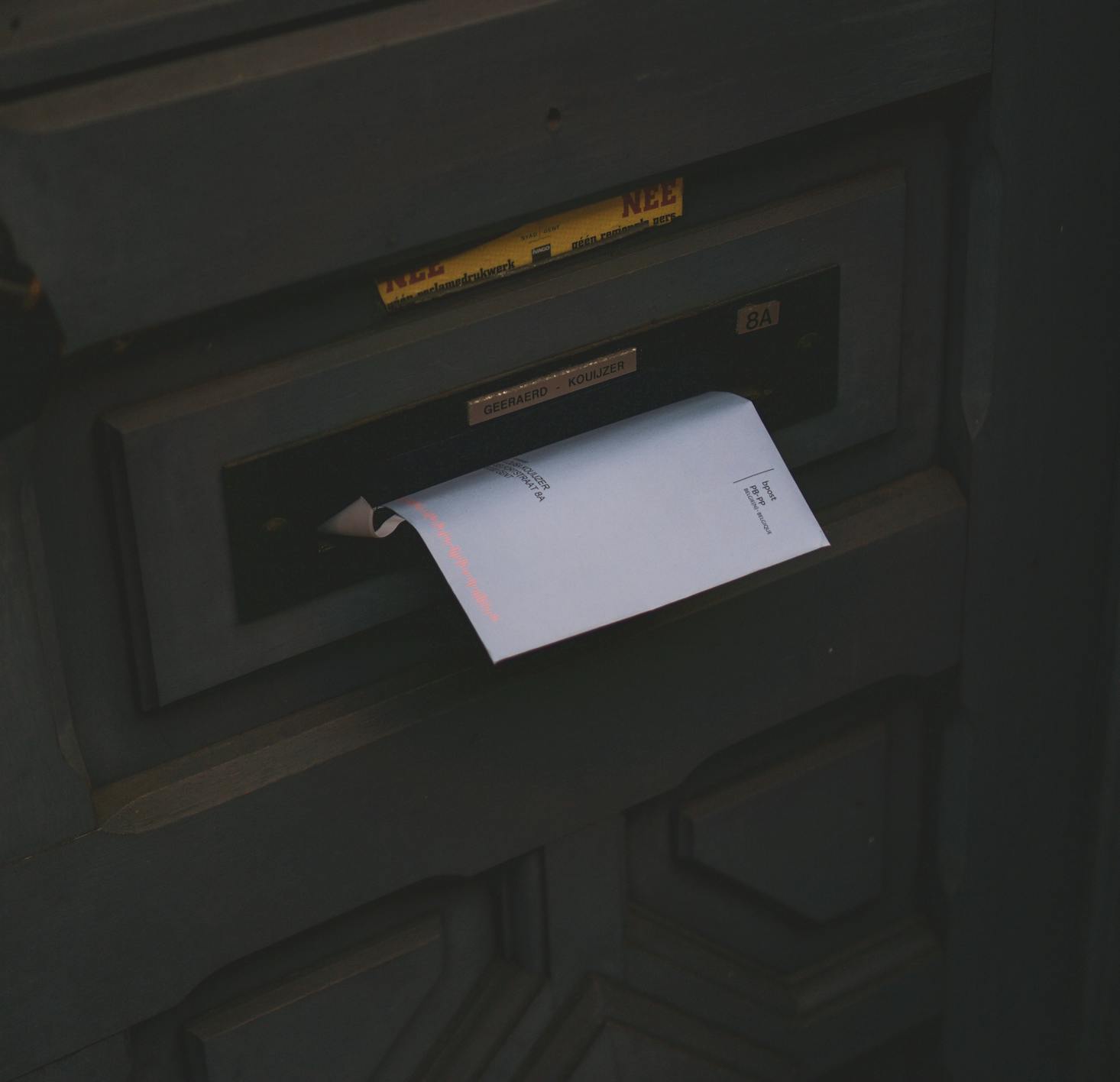 Mailbox with mail being inserted