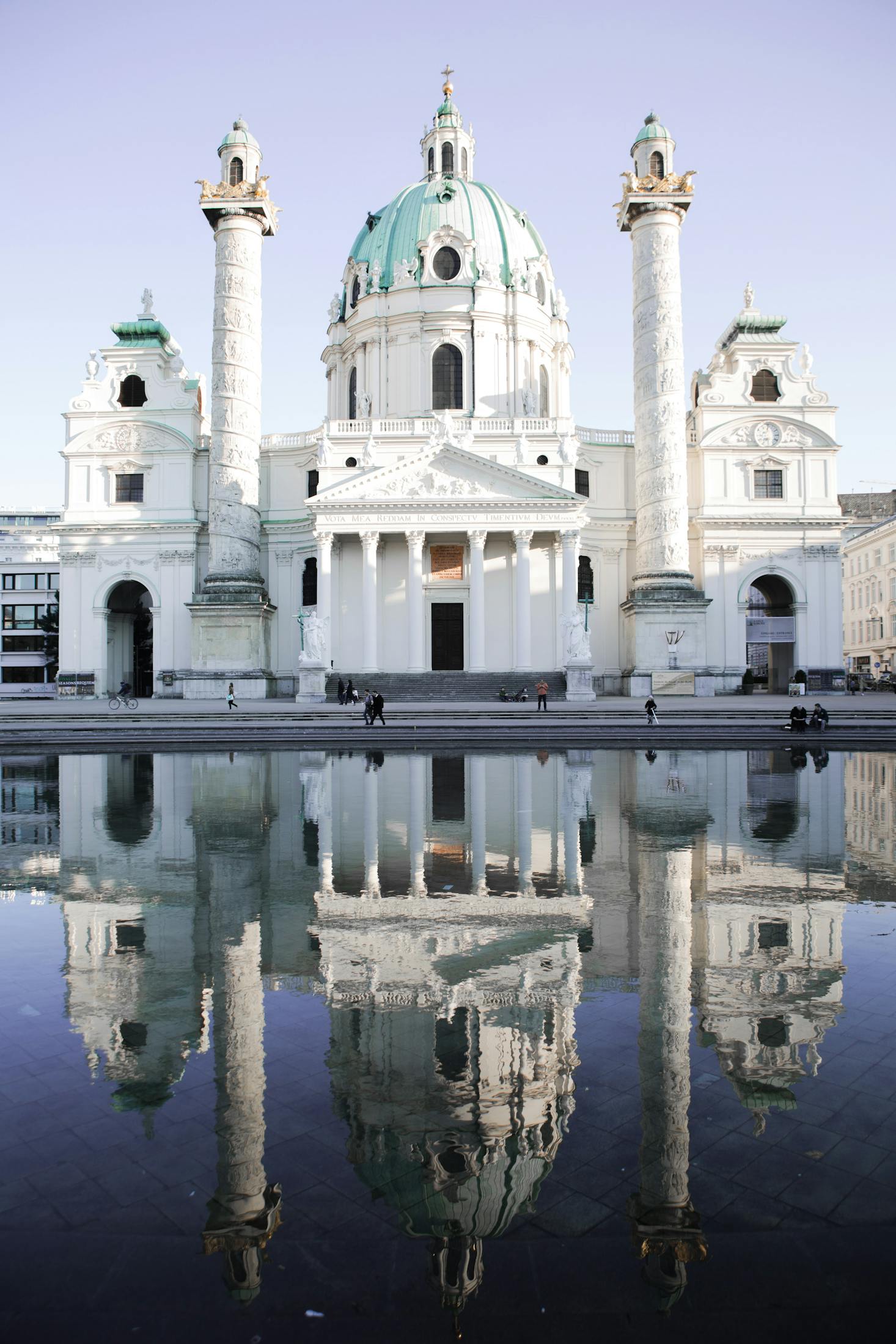 A large palatial building overlooking still water in Vienna