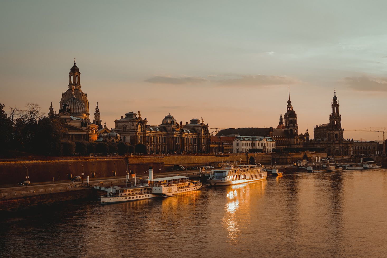 A pink sky outlines the city of Dresden, Germany on the shore of the River Elbe