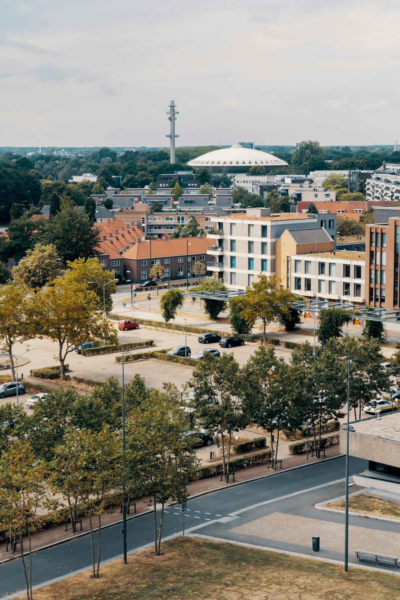 Modern and traditional buildings surround a car park in Eindhoven, Netherlands