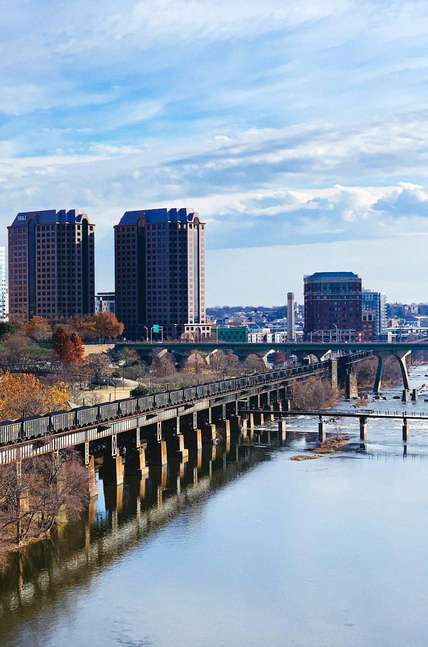 The waterfront in Richmond, VA in the winter with tall buildings in the distance