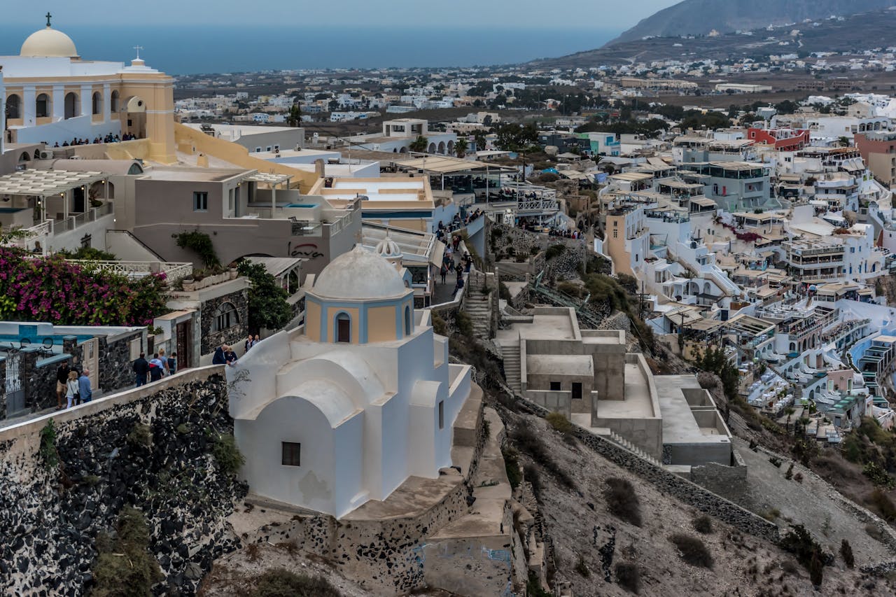 View of Santorini buildings down to the sea from Fira