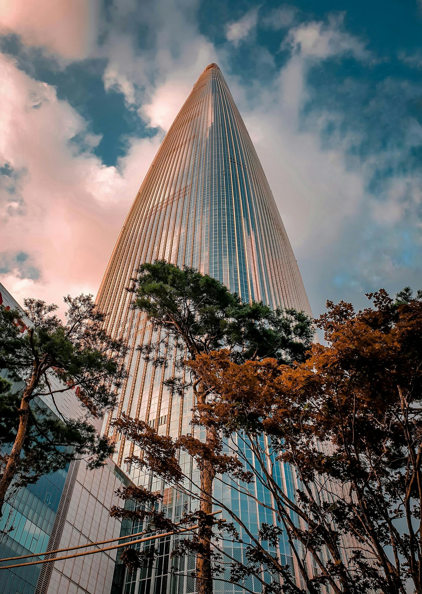 Tower at Lotte World in Seoul colored pink by the sunset