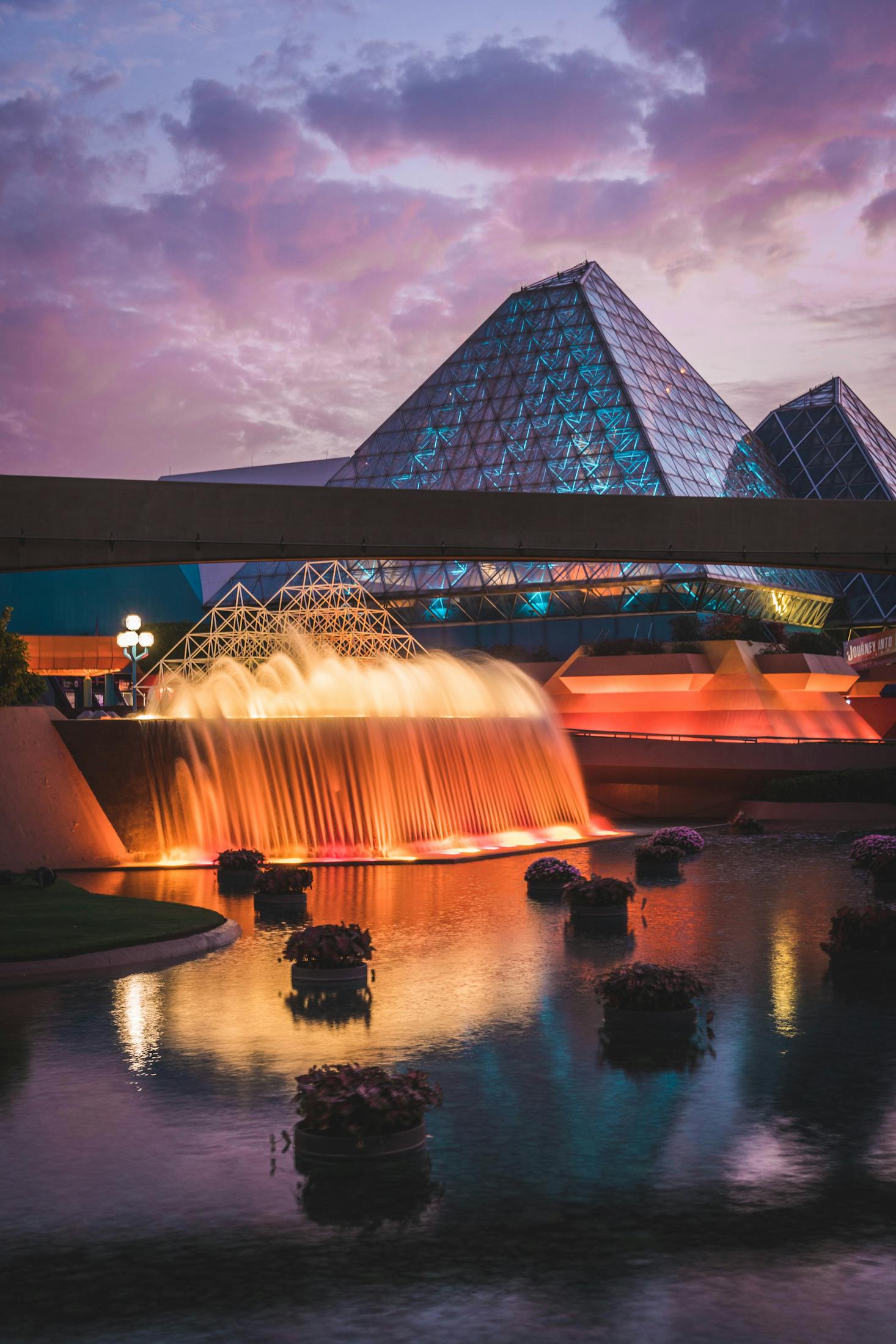 A lit up, cascading water fountain in Orlando, Florida