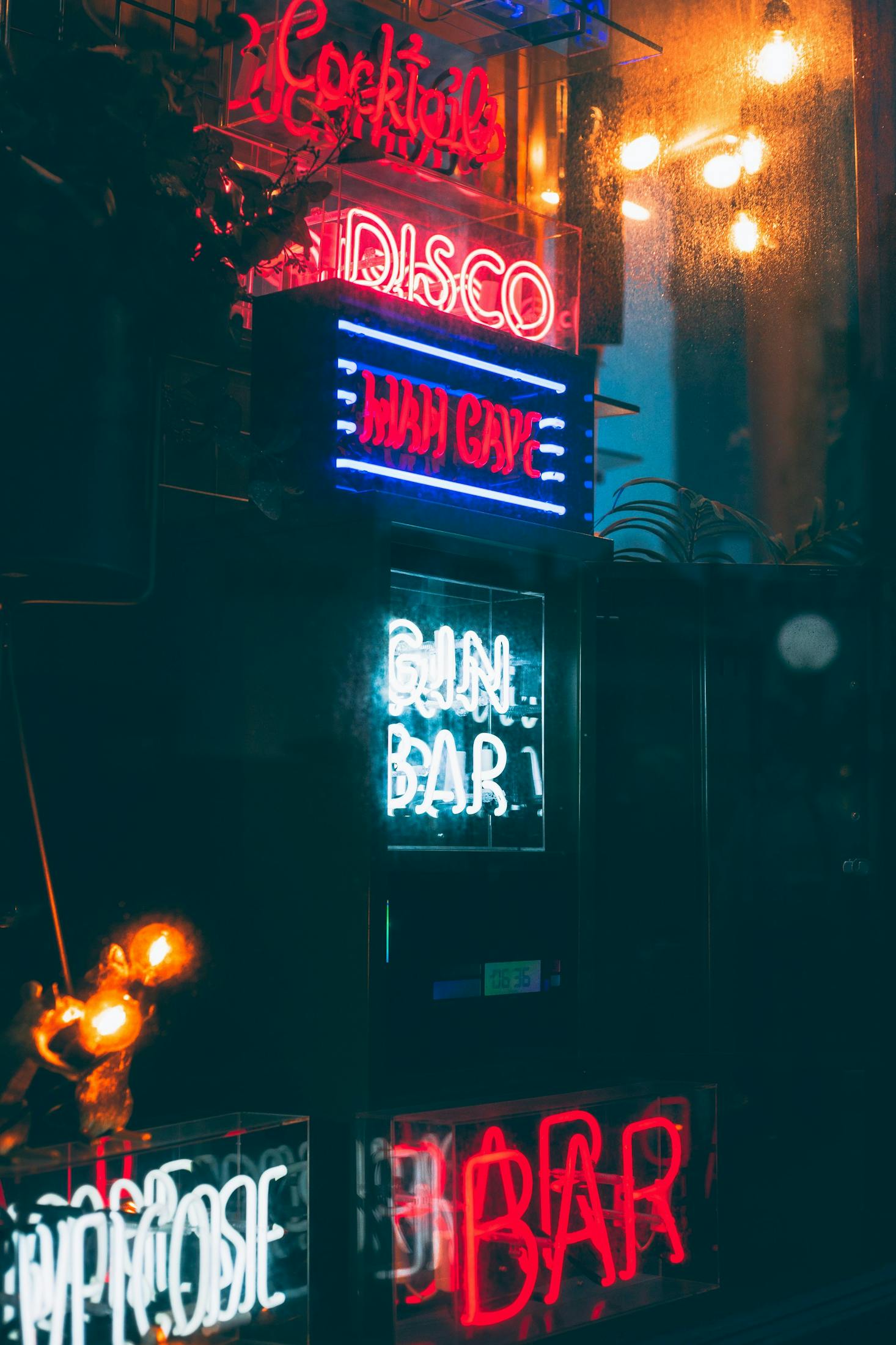 Neon signs lit up at night for a bar in Brighton