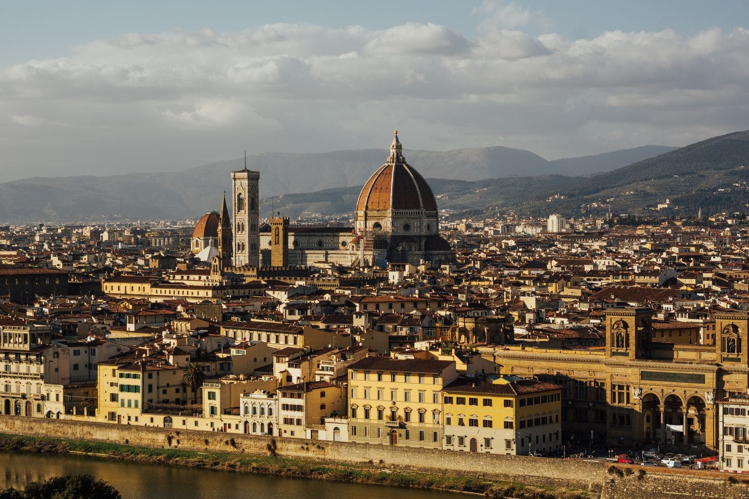 Florence cityscape featuring the Cathedral Santa Maria del Fiore, Giotto's Bell Tower, and the city skyline