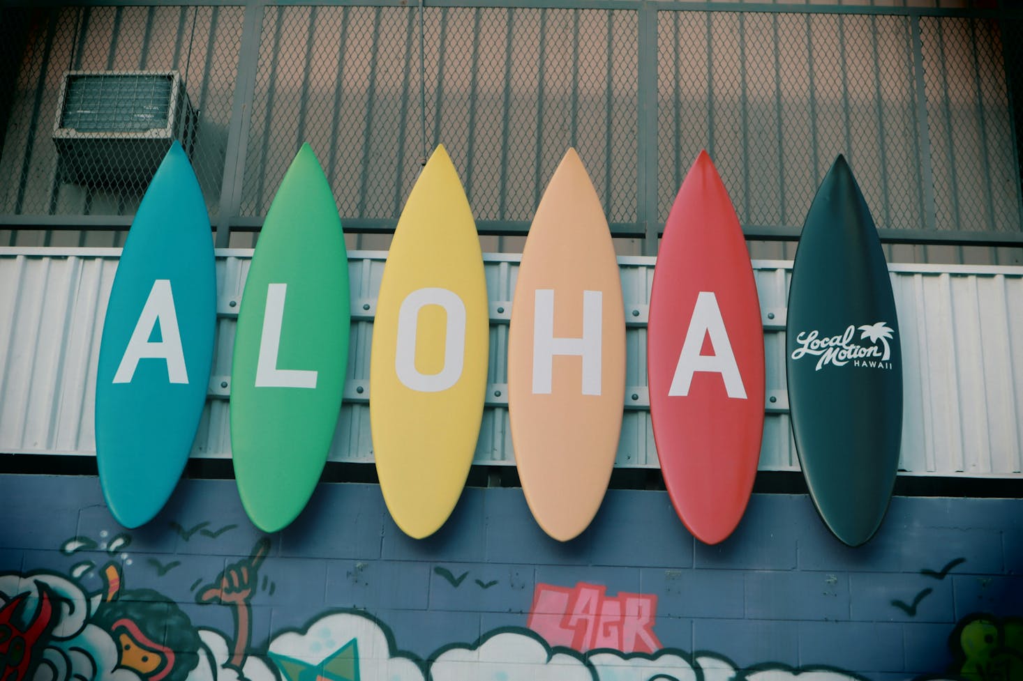 An Aloha sign in Honolulu made of colorful surfboards