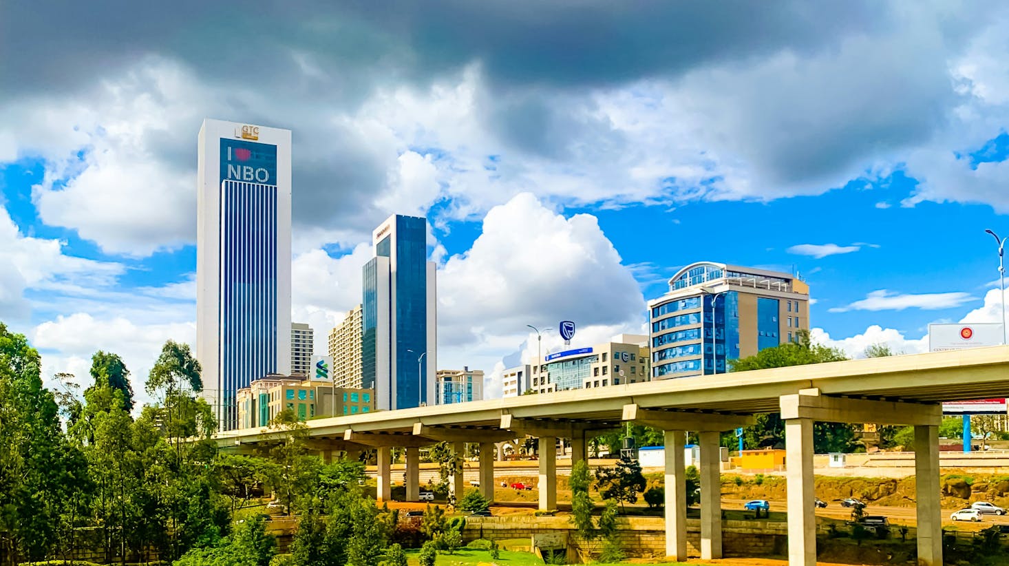 A bridge leading into the Westlands area of Nairobi with two large buildings in the distance