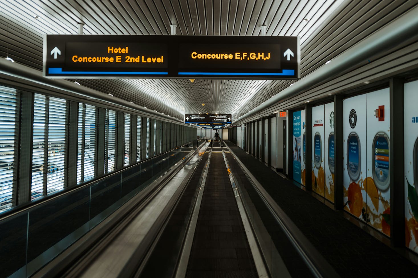 An empty motorized walkway to the gates at Miami Airport 