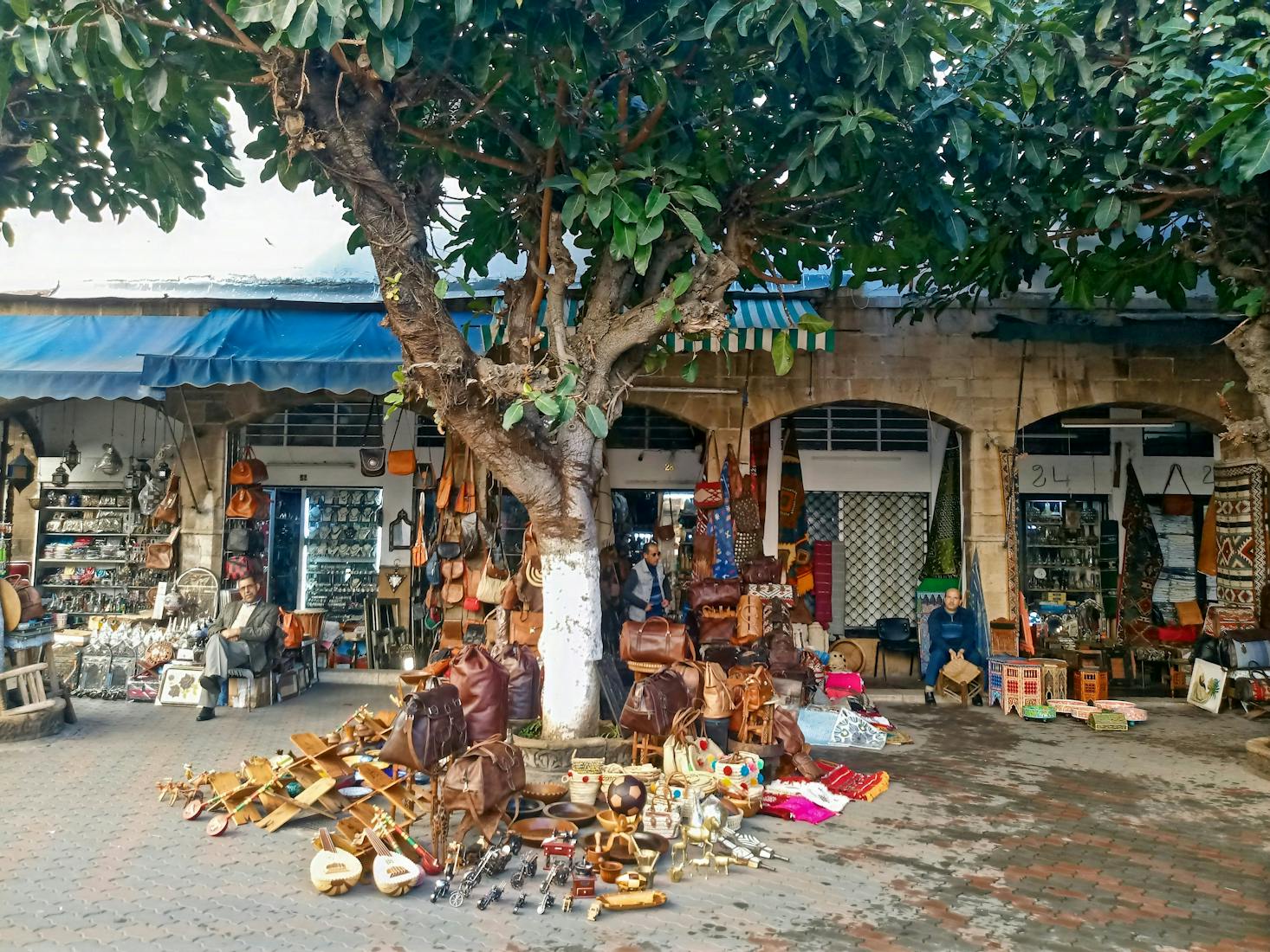 Shops and goods for sale on the sidewalk in the Habous Quarter of Casablanca