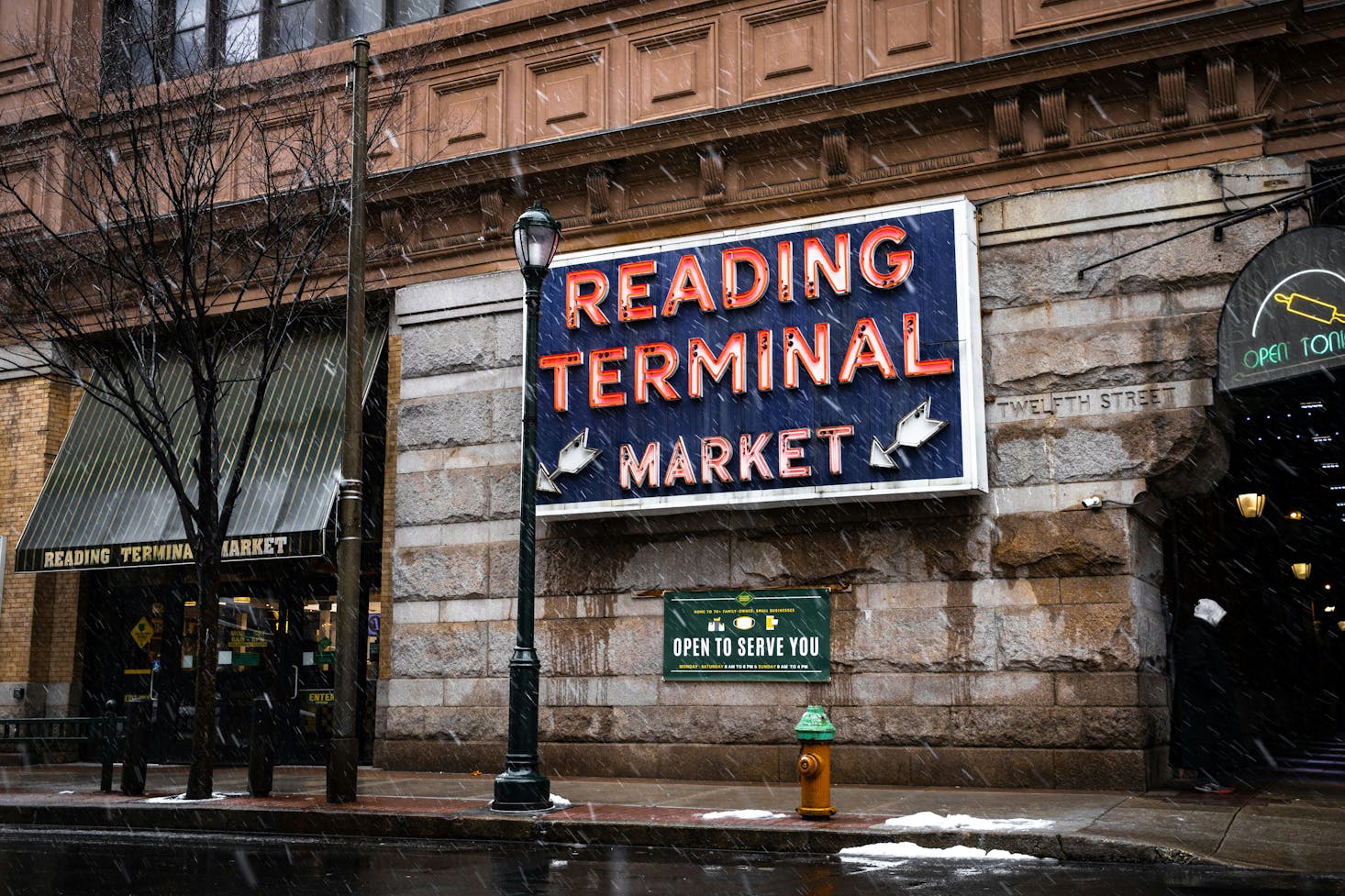 The red neon sign on the exterior of the Reading Terminal Market