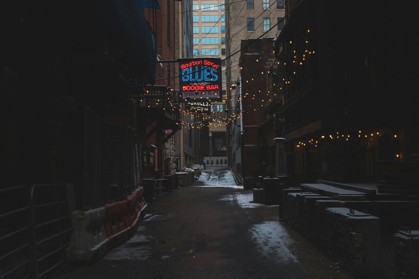 Neon sign for a bar in Nashville with a small dusting of snow on the ground