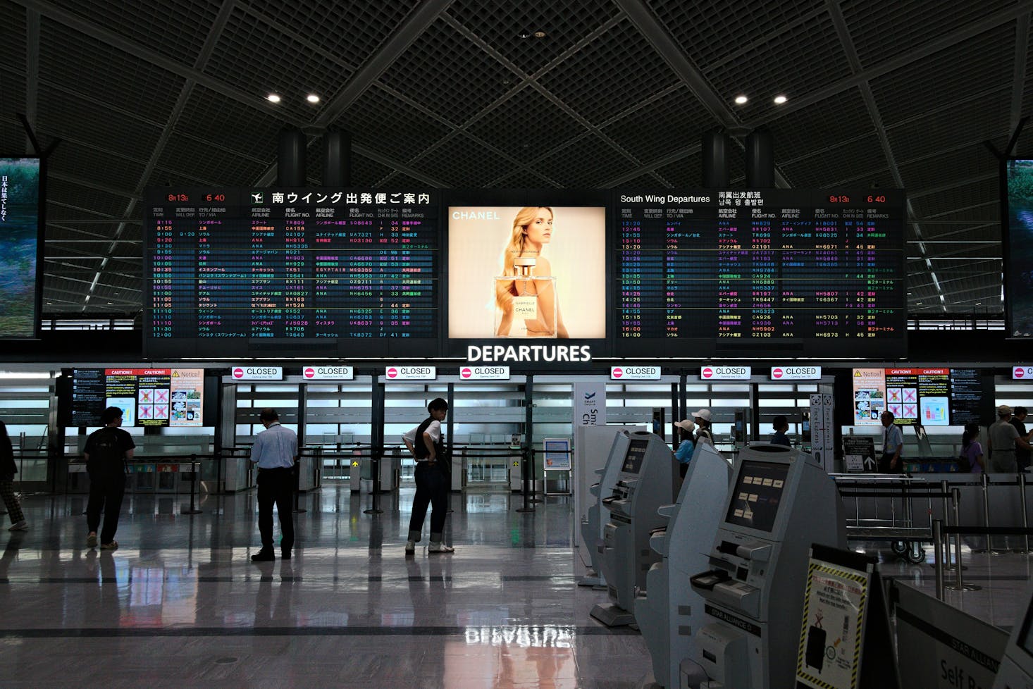 People waiting for a train at Narita Airport Station in Chiba