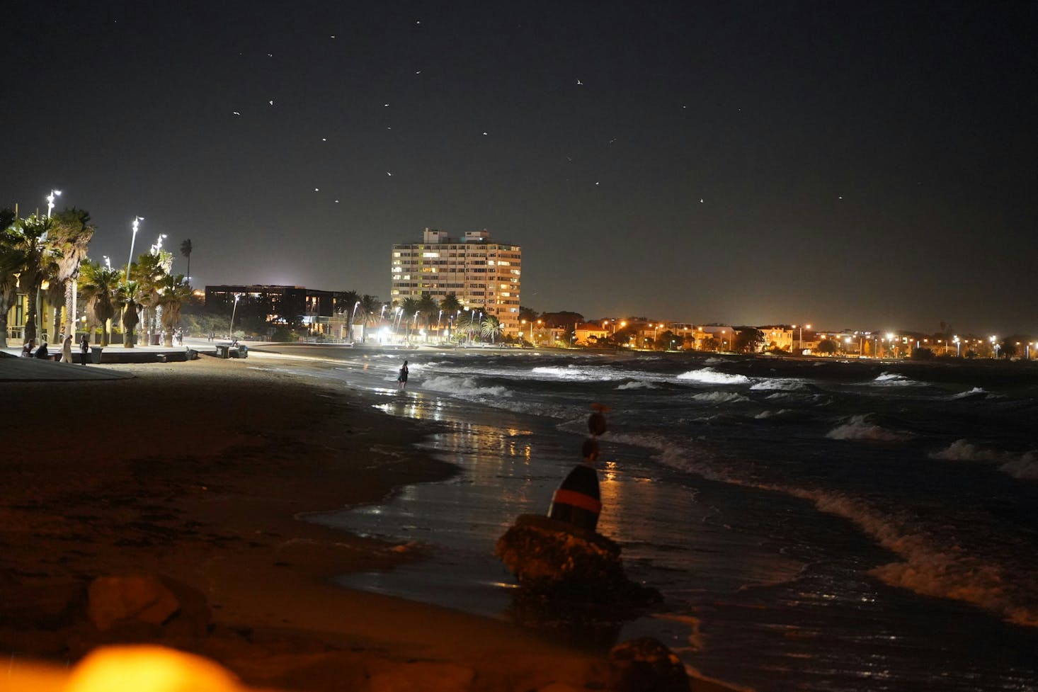 The beach at St Kilda Pier in Melbourne at night