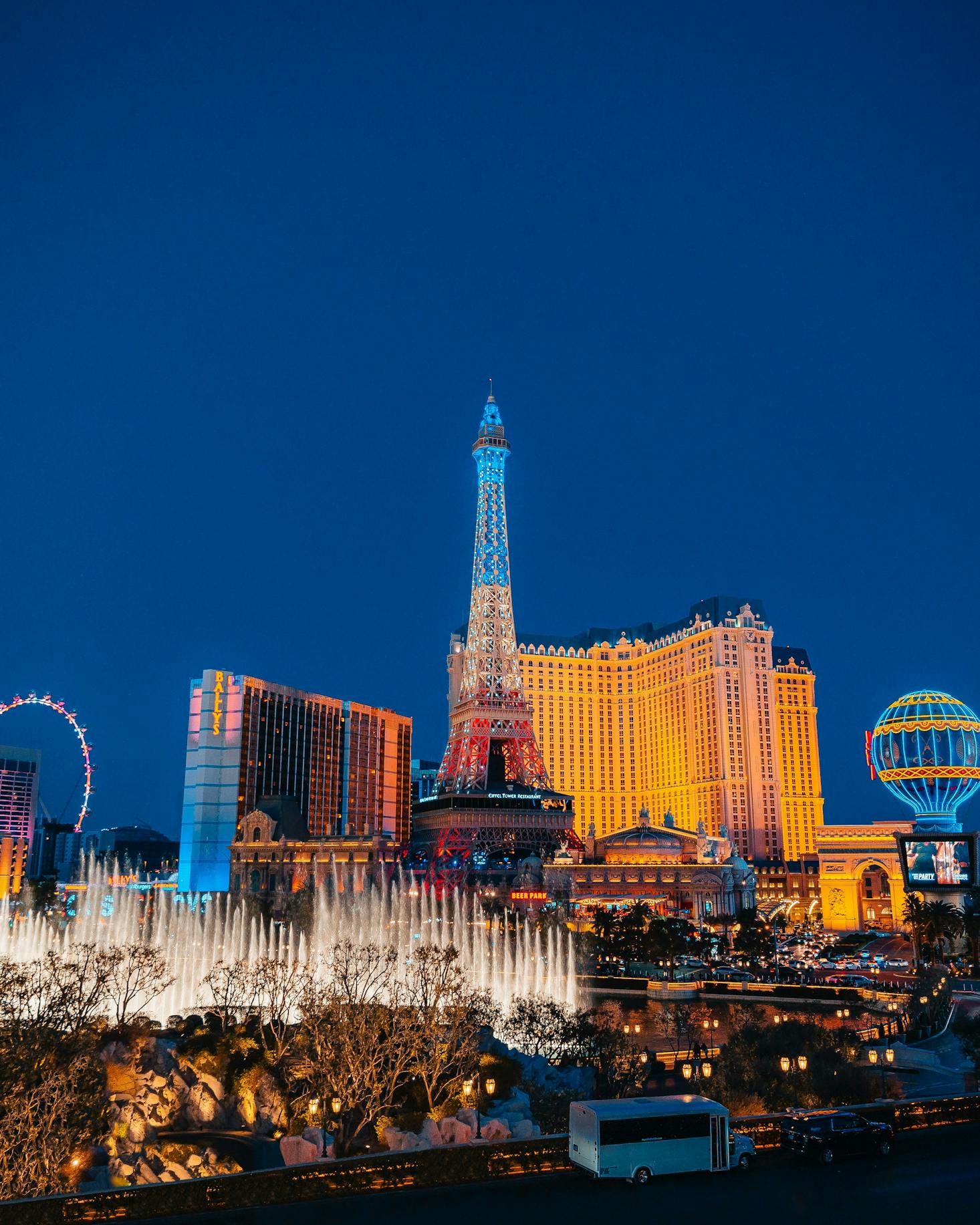 The Paris Hotel lit up on the Las Vegas Strip at dusk