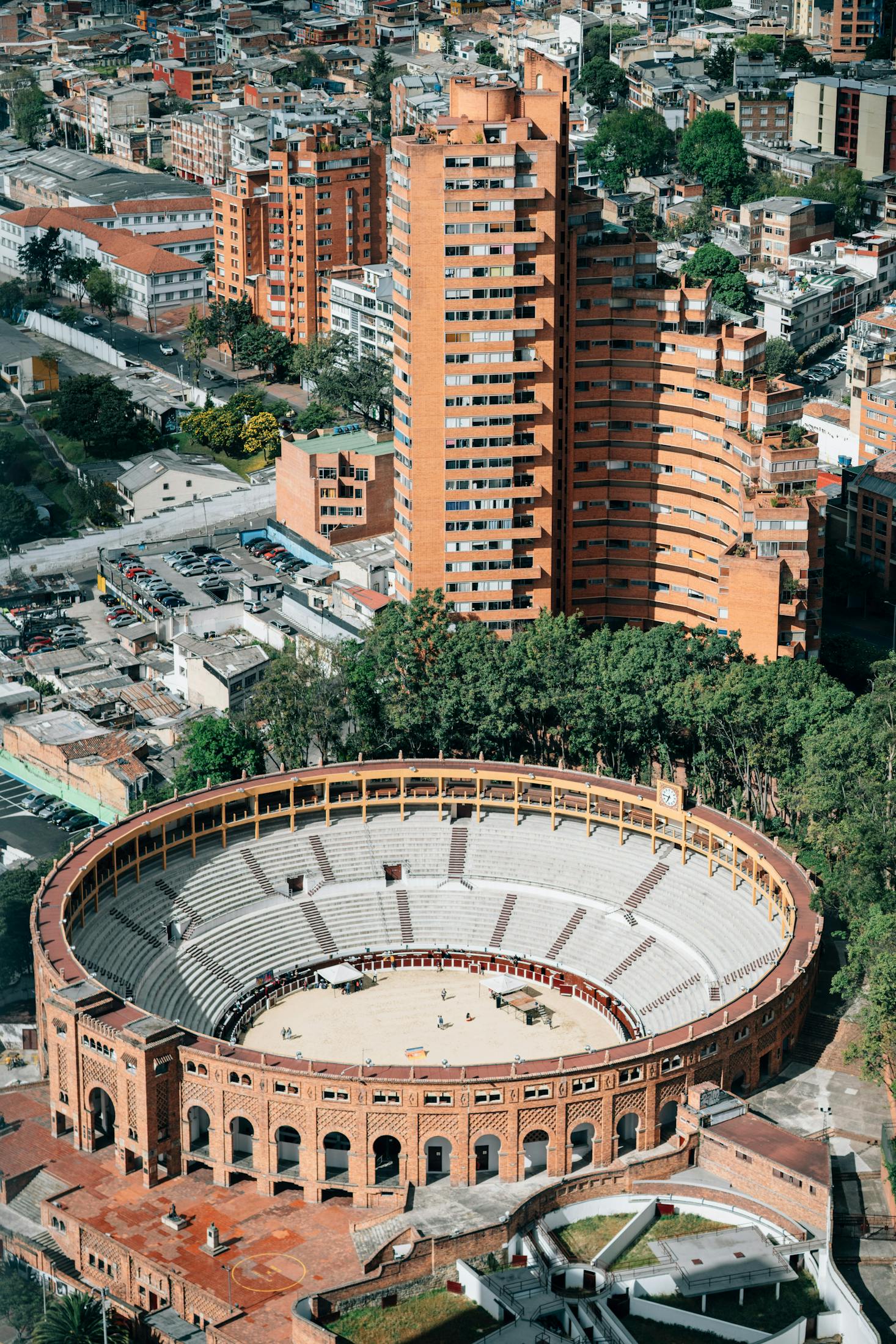 View from above of the historic bullring in Bogota with surrounding trees and tall buildings