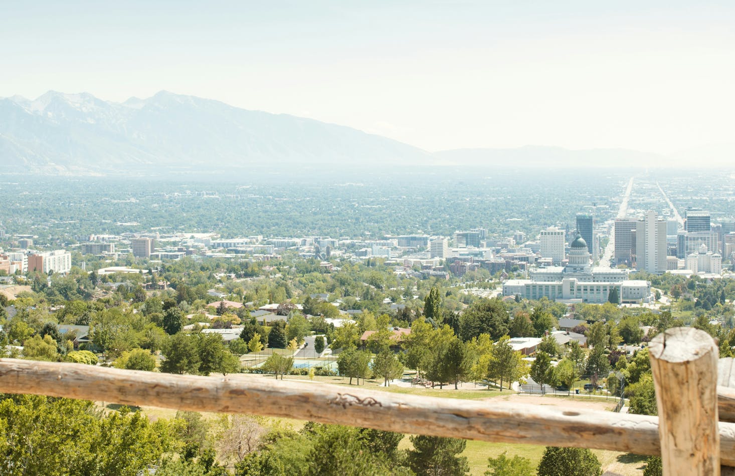 View over Salt Lake City on a hazy afternoon with mountains in the distance