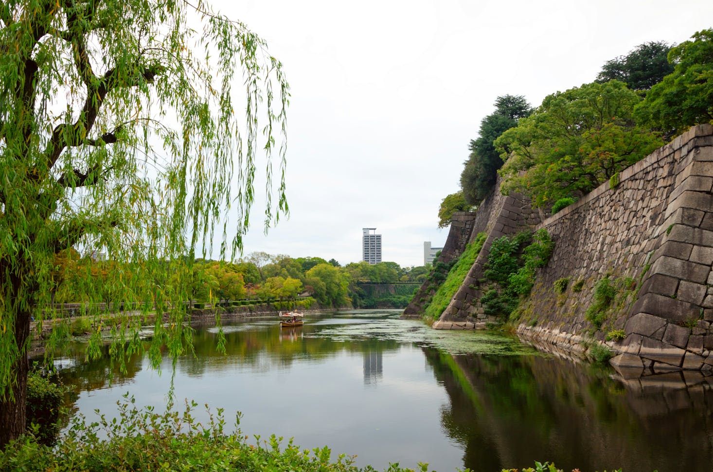 A pond at Osaka Castle on a cloudy day