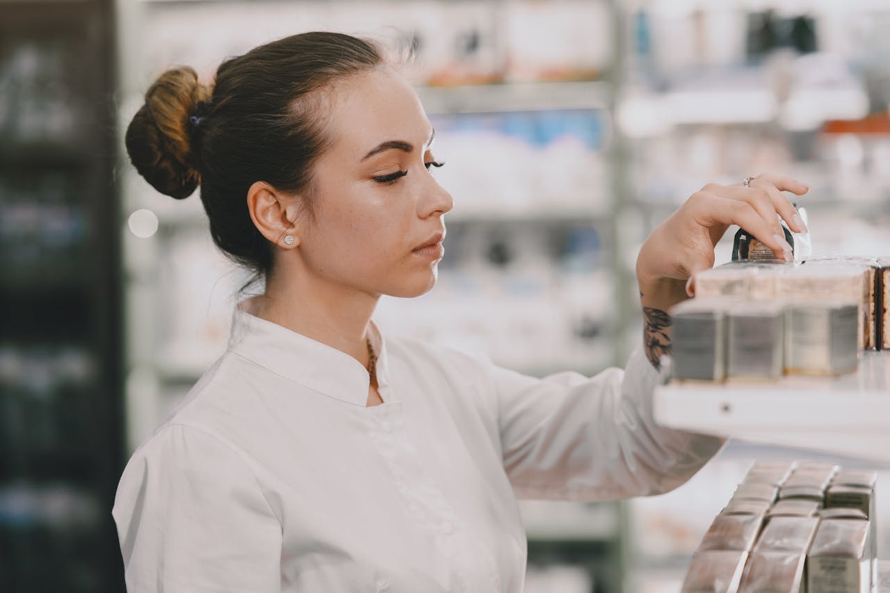 Professional examining beauty products on a shelf in a well-lit setting