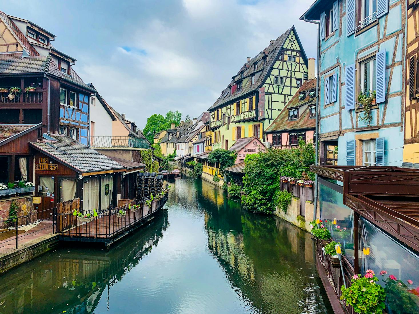 Colorful shops and homes along a canal in Colmar