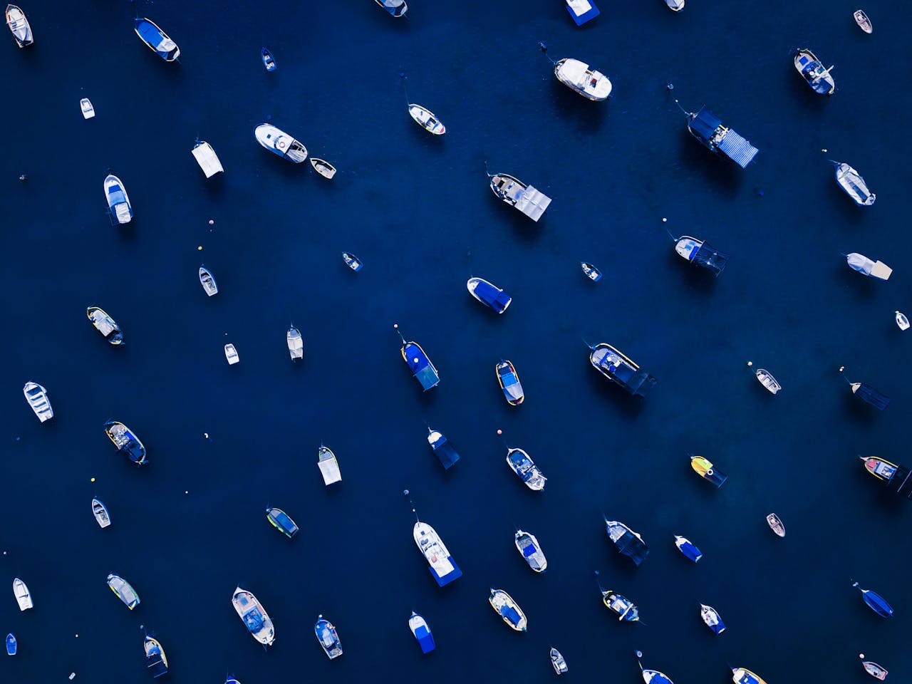 Aerial view of many different boats at sea