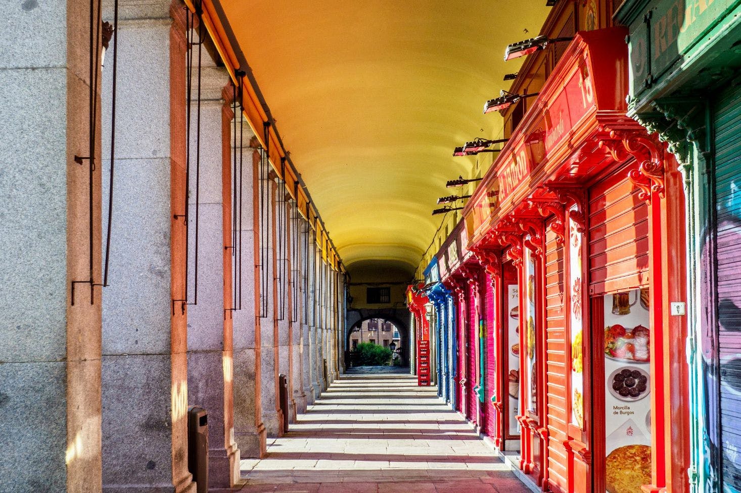 Plaza Mayor in Malaga with cute and colorful shops closed in the early morning