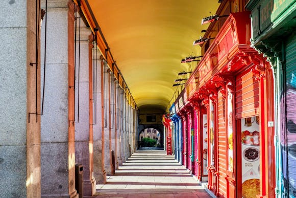 Plaza Mayor in Malaga with cute and colorful shops closed in the early morning