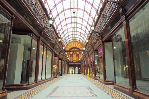 Corridor of the Central Arcade in Newcastle with arched dome and wood-trimmed store windows