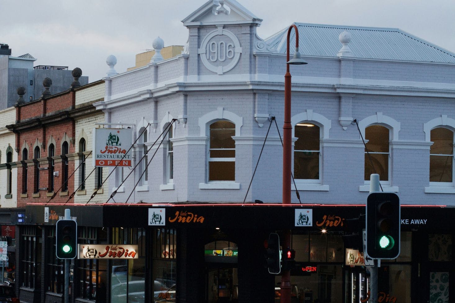 Street view of the building with old architecture but modern look of a restaurant and shops in Hobart 