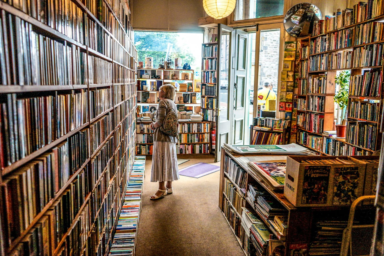 A person shopping in Edinburgh at an independent bookstore