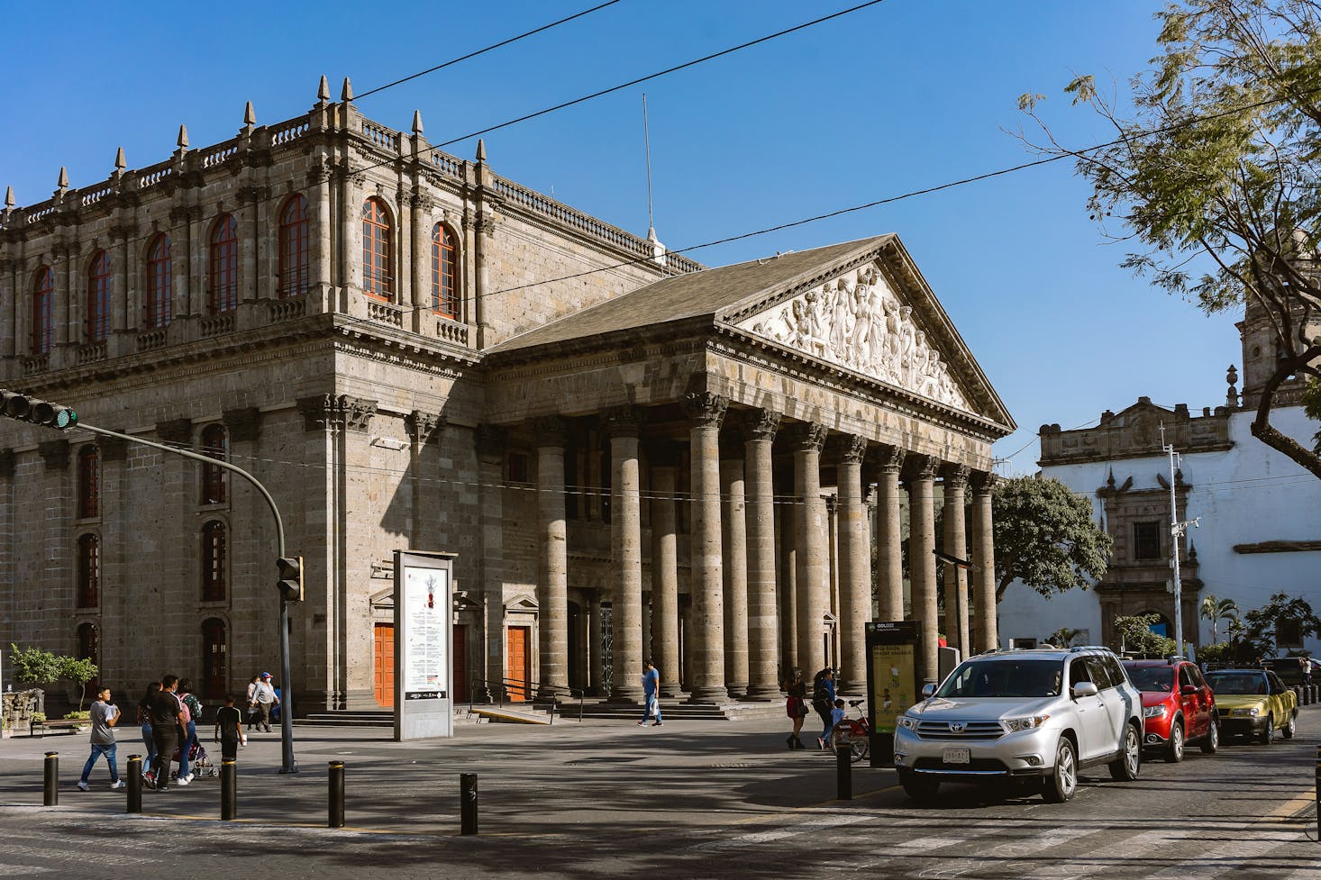 Brown stone theater with columns in historic Guadalajara