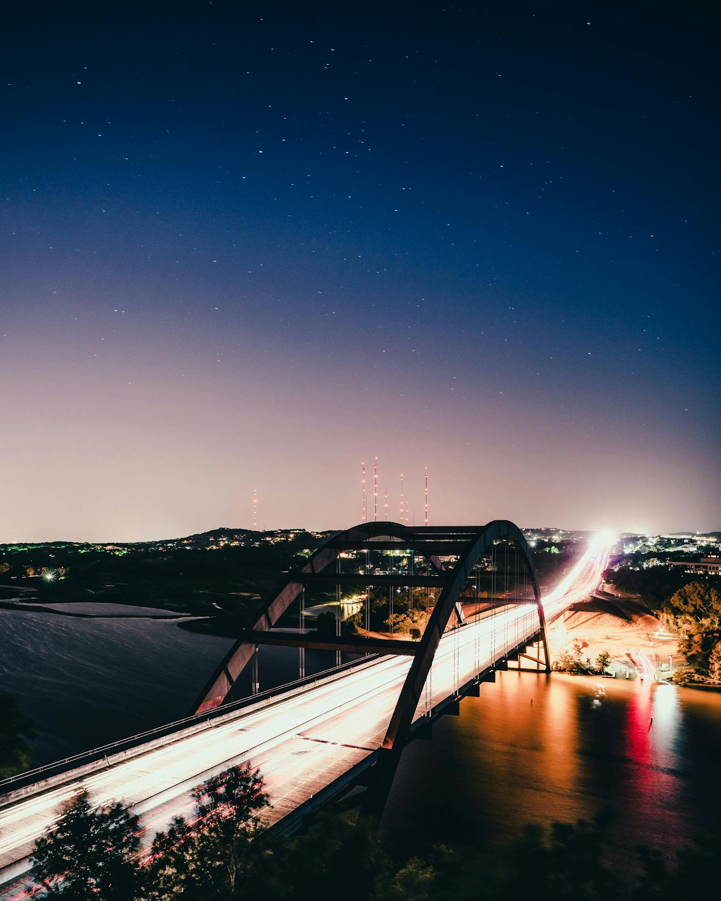 A bridge over the Colorado River in Austin at night