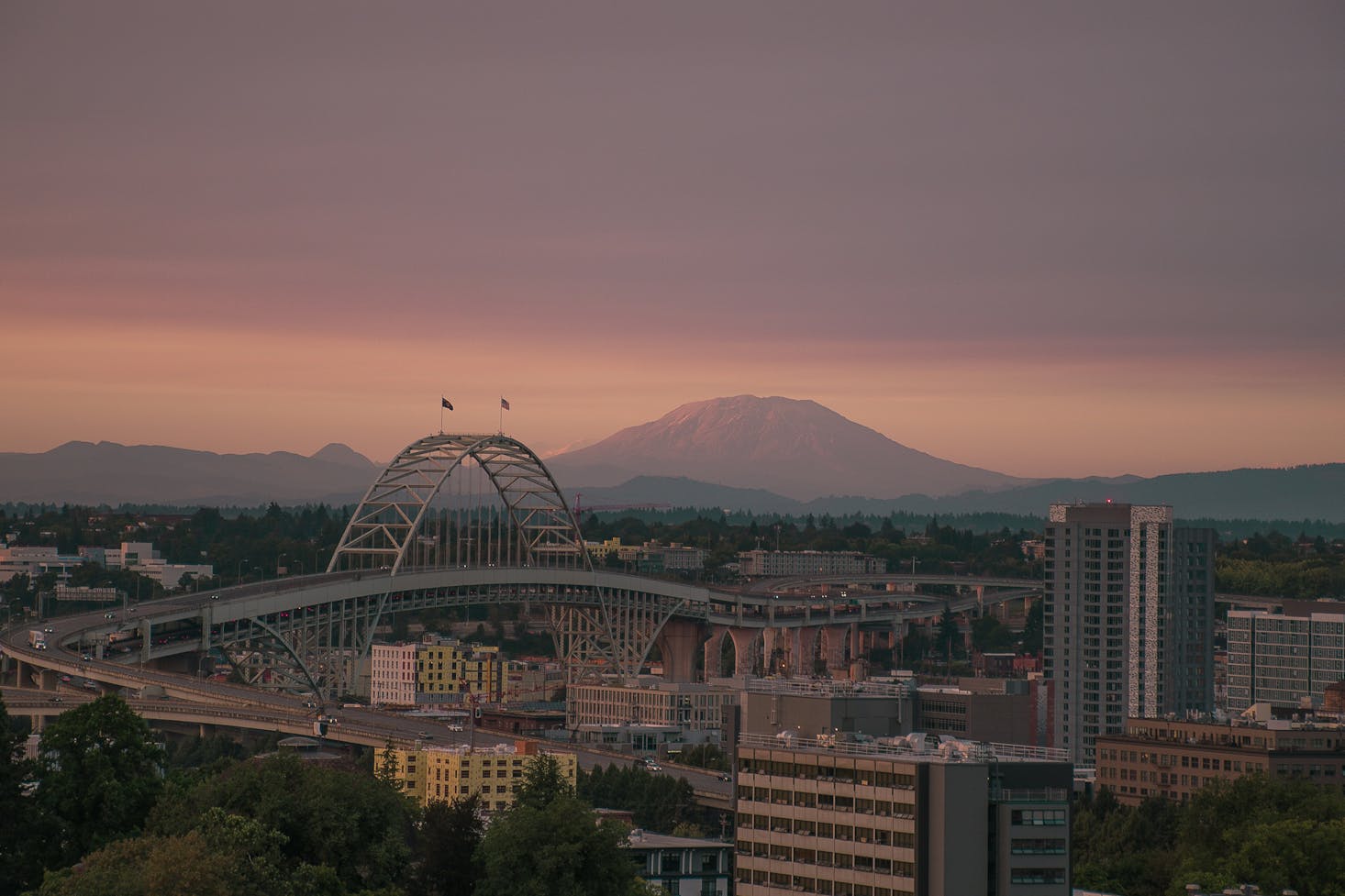 A large bridge snaking through Portland at sunset