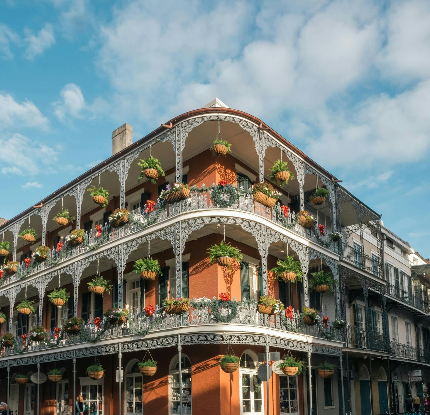 Historic yellow buildings in New Orleans with intricate ironwork on the balconies