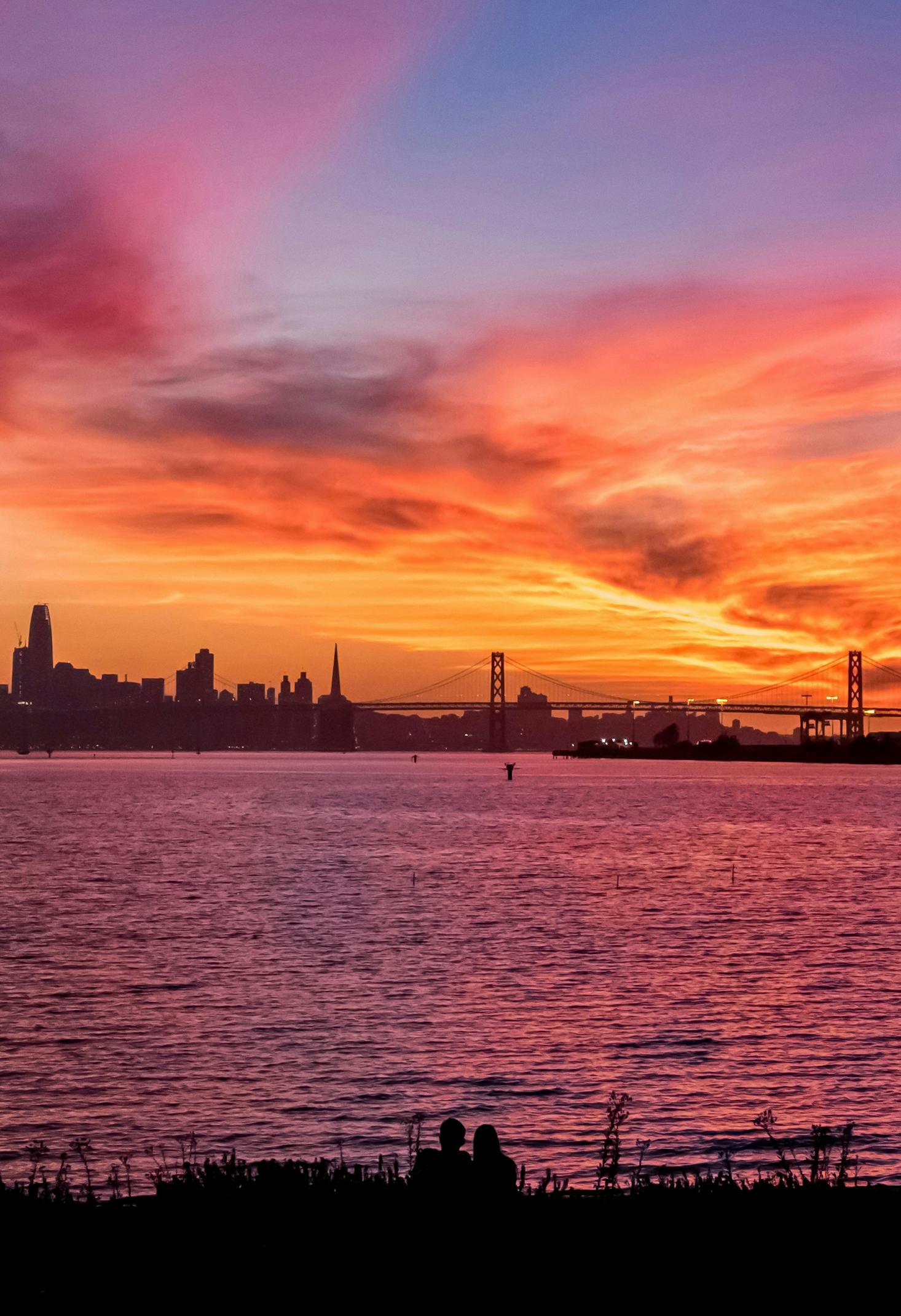 Distant view of the Golden Gate Bridge from Oakland at sunset