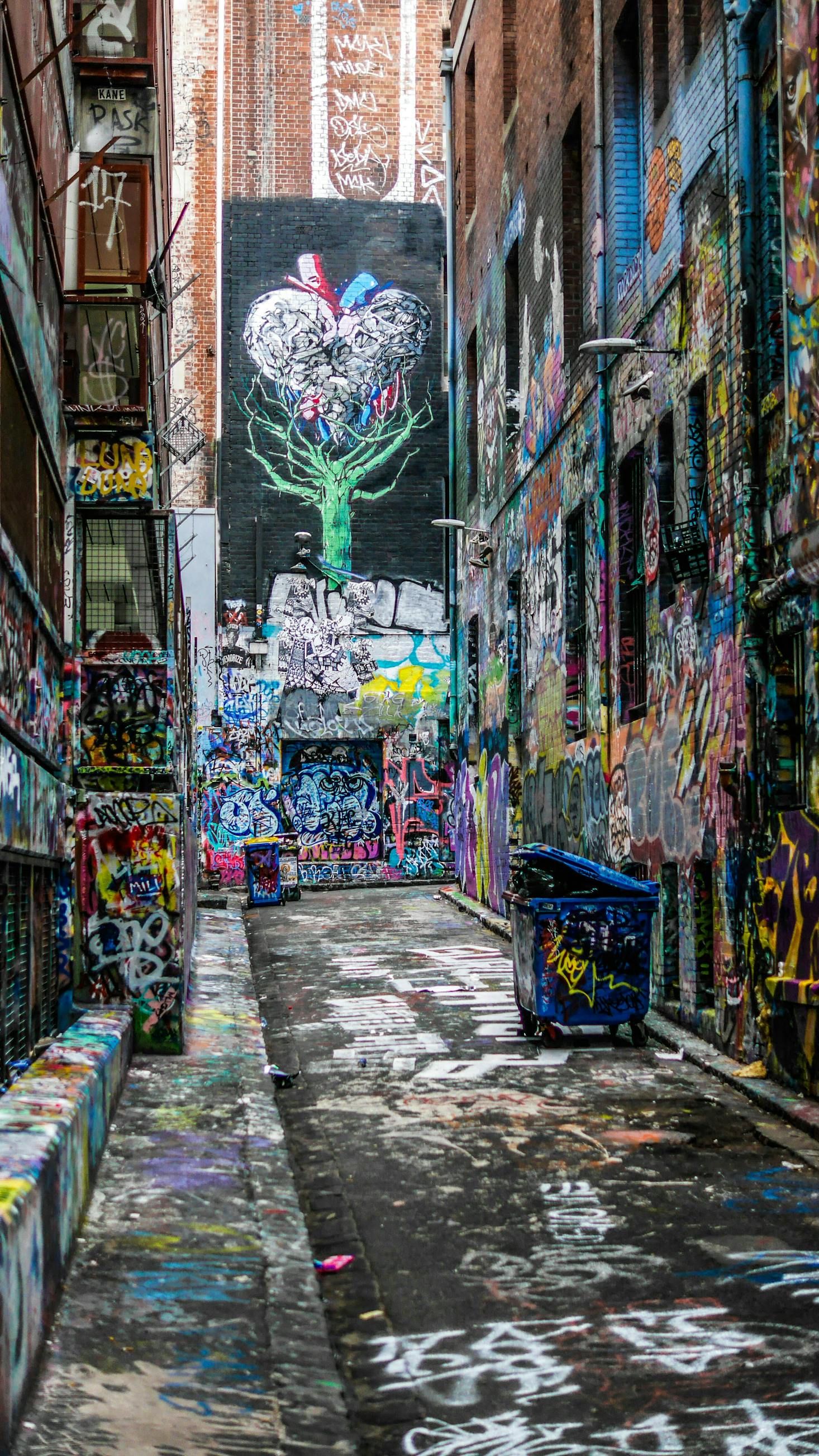 An alley in Melbourne full of colorful graffiti