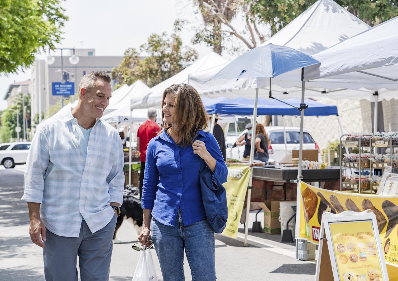 A couple walking through vendor stalls at Rockport Fulton Market Days